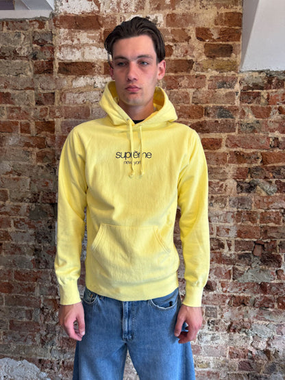 Supreme New York Yellow Logo Hoodie.