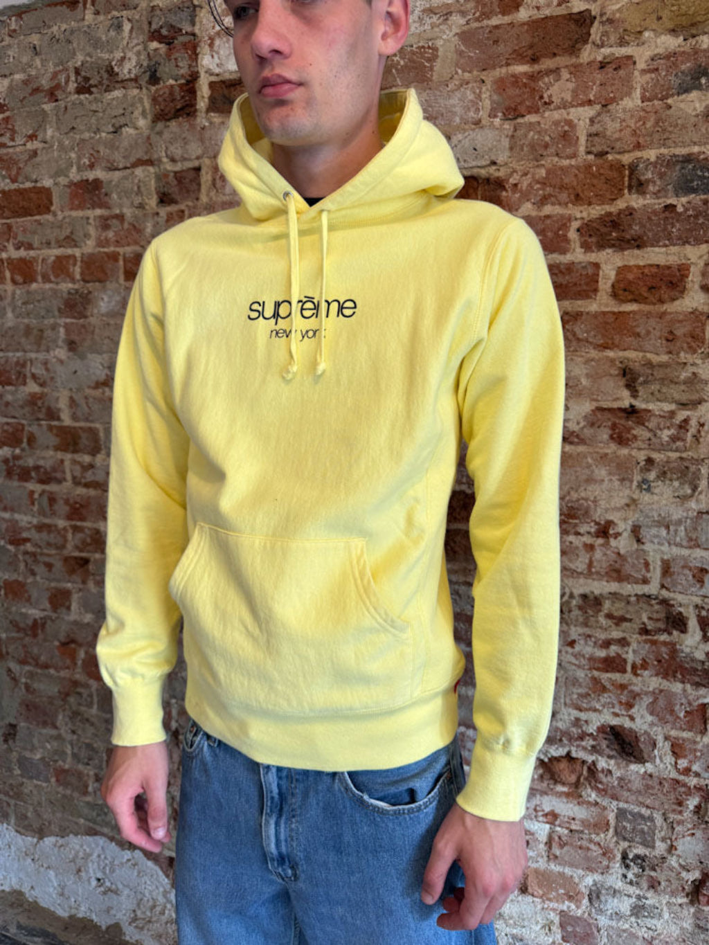 Supreme New York Yellow Logo Hoodie.