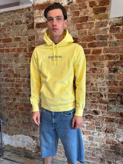 Supreme New York Yellow Logo Hoodie.