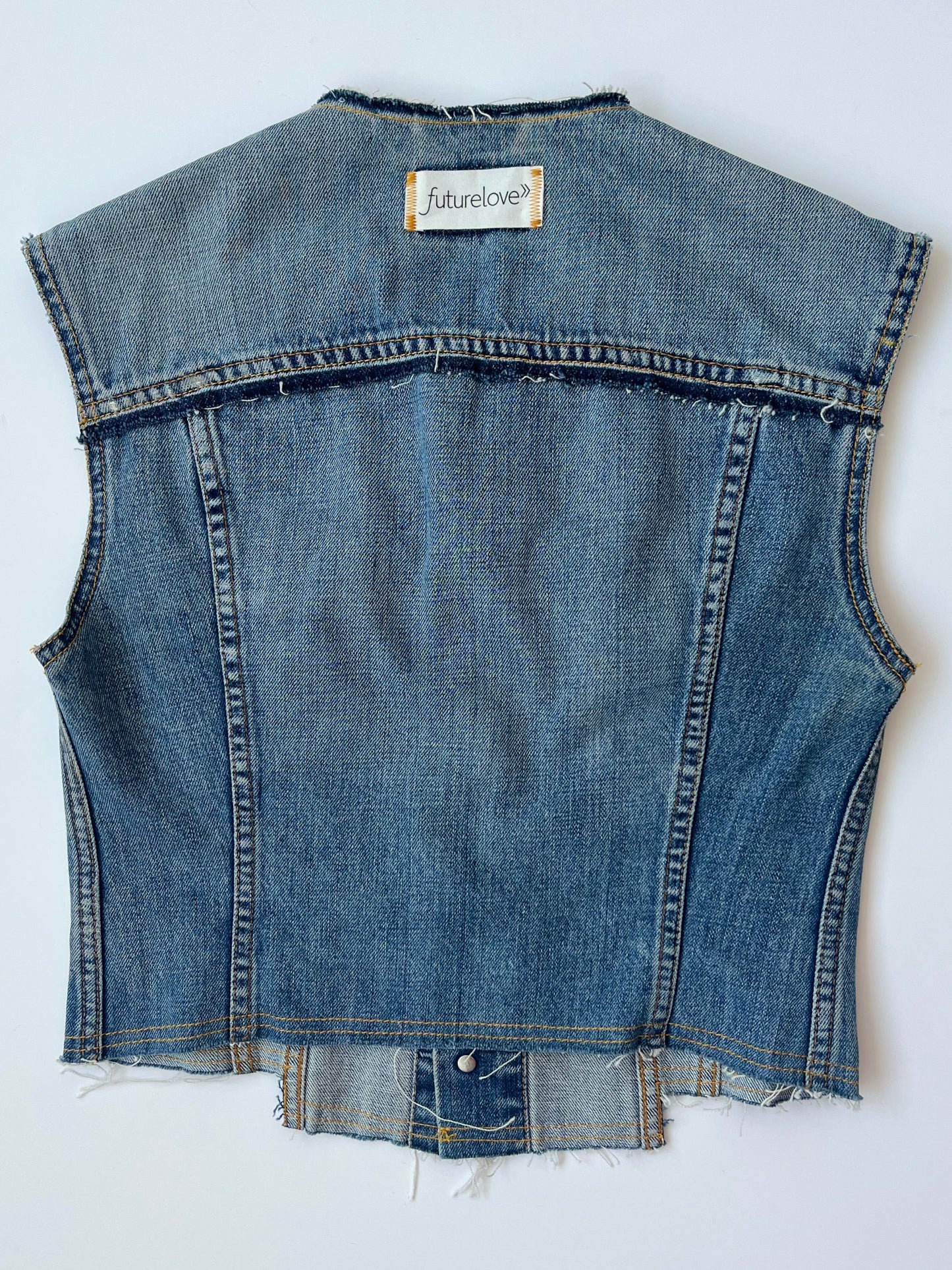 Berta mid wash denim waistcoat with stepped hem detail