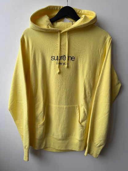 Supreme New York Yellow Logo Hoodie.