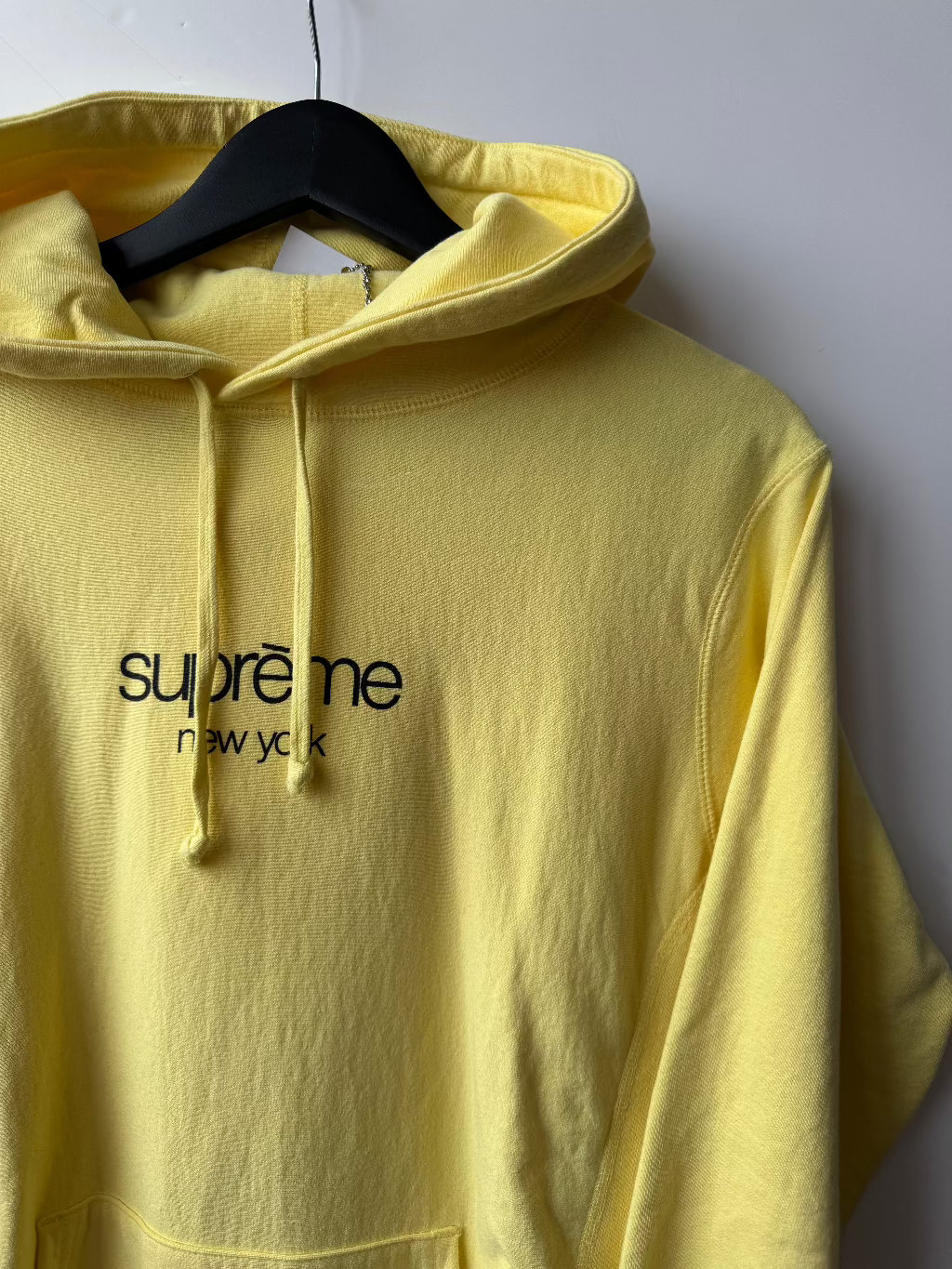 Supreme New York Yellow Logo Hoodie.