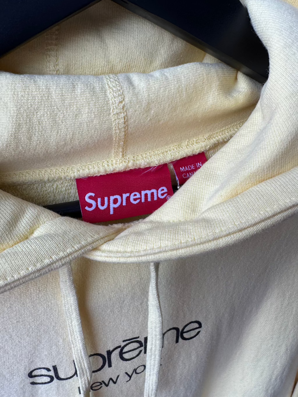 Supreme New York Yellow Logo Hoodie.