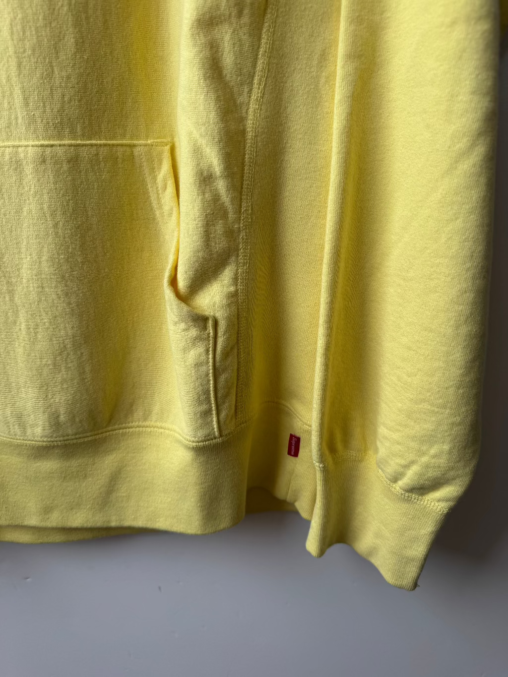 Supreme New York Yellow Logo Hoodie.